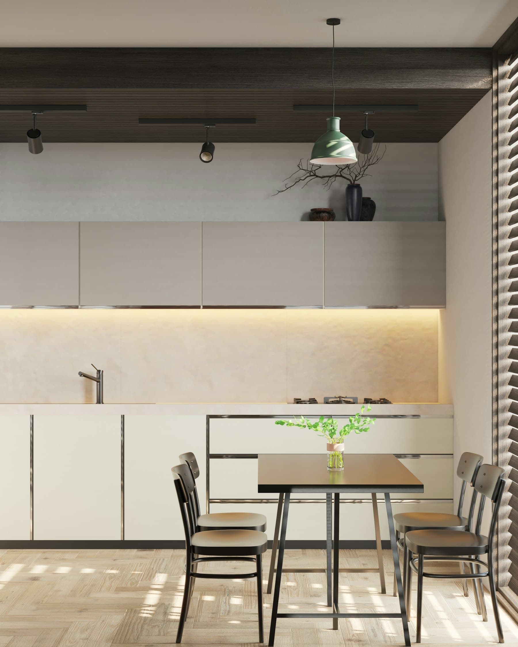 Cocina abierta al comedor con mesa de madera oscura y sillas de enea junto a la ventana
